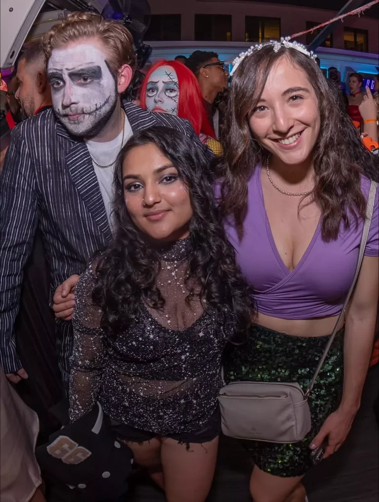Group of friends in Halloween outfits posing at Clarendon Ballroom nightclub in Arlington, VA